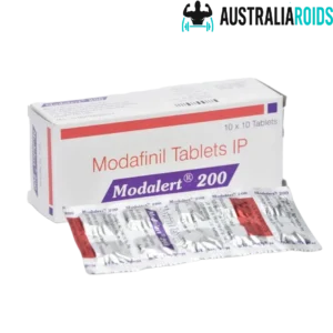 Modalert 200mg Modafinil Tablets IP box and blister pack on a dark background.